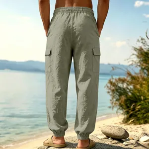 Men's sage green linen cargo pants with elastic waist and pockets for beach casual wear