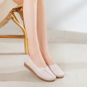 Comfortable beige leather loafers for middle-aged women, perfect for work or casual wear.