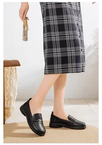 Side view of comfortable black leather flat loafers with soft sole for women