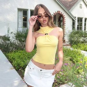 Detailed shot of a trendy yellow halter neck tank top featuring a metal buckle and slim fit