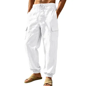 Close-up detail of men's white linen cargo pants with adjustable drawstring waist