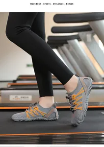 Grey and orange quick-dry wading shoes worn on a treadmill for fitness and hiking