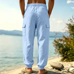 Detailed back view of men's light blue linen cargo pants with side flap pockets