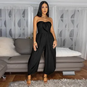 Chic strapless black jumpsuit featuring a front knot detail and wide-leg silhouette