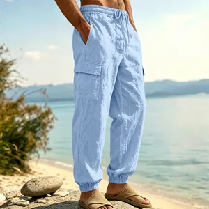 Detailed view of light blue men's linen cargo pants with elastic waist and side pockets