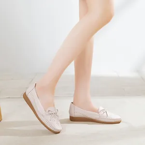 Breathable beige women's loafers with bow detail and perforated design for all-day comfort
