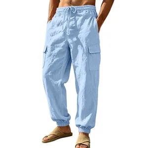 Detailed view of light blue linen cargo jogger pants for men with pockets