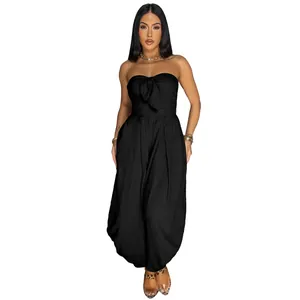 Elegant black strapless wide-leg jumpsuit with a front knot detail on a model