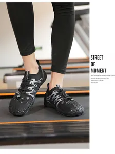Close-up of black quick-dry water shoes worn on a treadmill for hiking and outdoor sports.