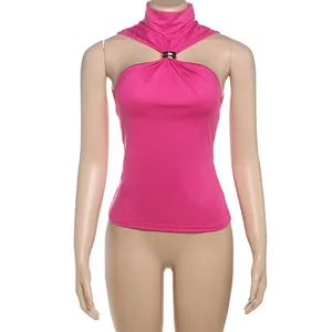 Detail view of a sexy pink sleeveless halter neck top featuring a decorative gold metal ring