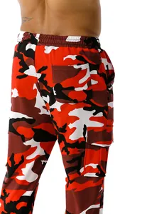 Close-up of red camouflage cargo pants with functional side pockets and elastic waist
