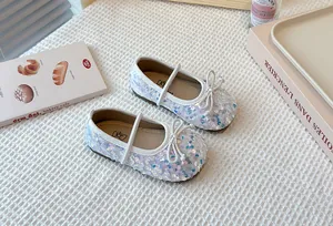Sparkly white sequin Mary Jane shoes for girls with adorable bow detail and soft sole