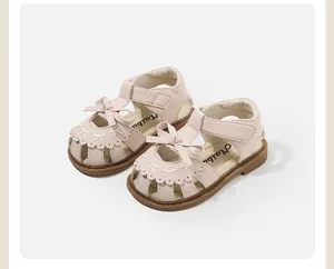 Detail showing pink toddler girl sandals with bow accents and soft anti-slip soles