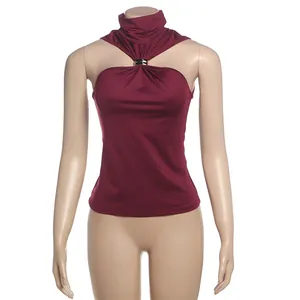 Detailed view of burgundy halter neck top with metallic gold ring accent and slim fit
