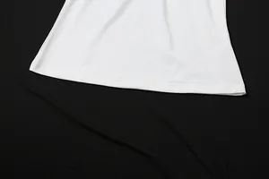 Detailed close-up of a white sleeveless top hem with precise double-needle stitching