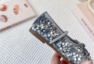 Detailed close-up showing silver sequins on a toddler girl princess shoe with soft sole.