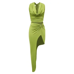 Detailed look at the lime green halter neck cowl top and asymmetrical high slit skirt set