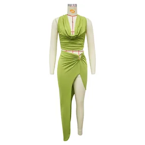 Detail view of lime green two-piece set featuring cowl neck top and high slit skirt