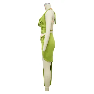 Side view of lime green halter cowl neck top and high slit skirt set on a mannequin.