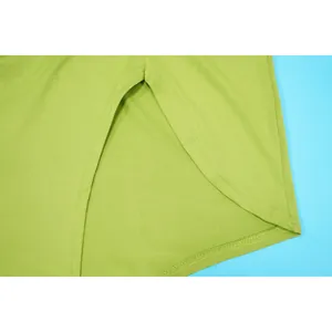Detailed macro view showing the high slit and stitching on a lime green sexy skirt
