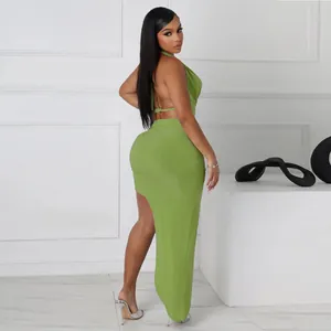 Detail view of sexy green halter neck top and high slit maxi skirt two-piece set