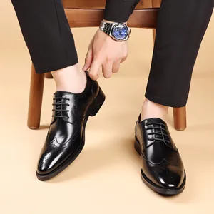 Classic black leather Brogue dress shoes for men with elegant wingtip carving details