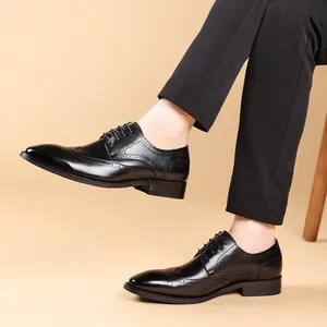 Men's black leather Brogue Oxford shoes with elegant wingtip carving detail