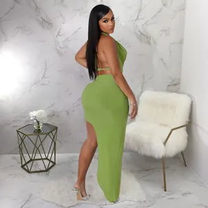 Back view of a lime green halter cowl neck top and high slit maxi skirt set for women.