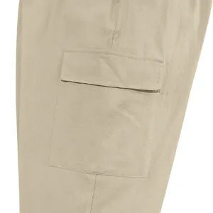 Close-up view of the side flap pocket and fabric texture on men's khaki linen cargo pants