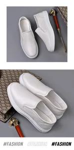 Detailed view of white men's slip-on driving loafers featuring premium faux leather texture