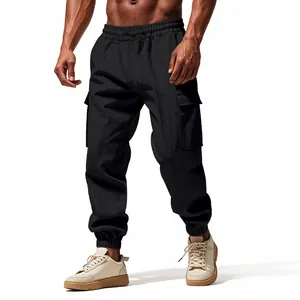 Detailed view of black linen cargo jogger pants featuring side pockets and elastic ankle cuffs.
