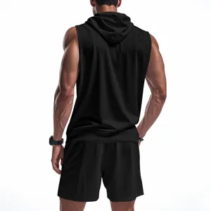 Back view of a muscular man wearing a black sleeveless hooded gym vest and shorts set