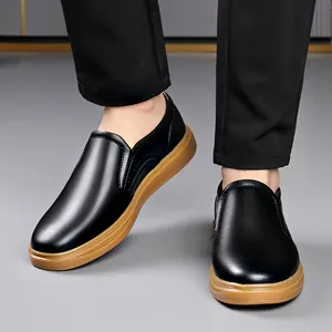 Men's black business casual loafers with comfortable tan rubber sole, ideal for driving and work