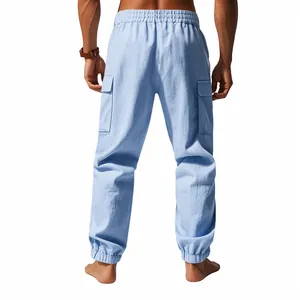 Back view of men's light blue linen cargo pants with elastic cuffs and side pockets