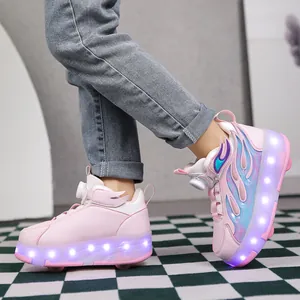 Close-up view of pink girls roller shoes featuring glowing LED light-up soles and flame wing design