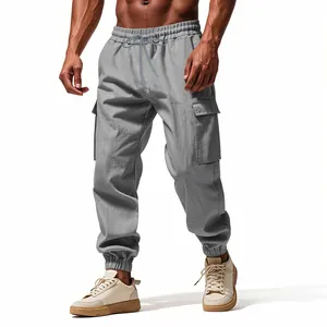 Detail shot of men's grey linen cargo joggers with drawstring waist and side pockets.