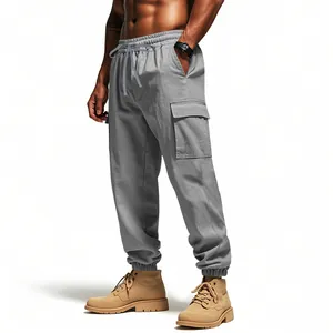 Detail view of men's grey linen cargo joggers with elastic waist and drawstring.
