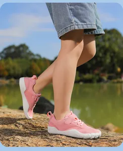 Pink breathable five-finger barefoot shoes for kids, flexible sole outdoor walking sneakers.