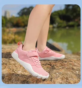 Detailed side view of pink breathable kids barefoot shoes for outdoor walking