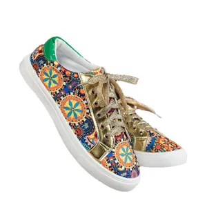 Vibrant women's mandala print canvas sneakers featuring metallic gold eyelets and green heel