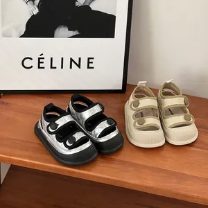 Detailed view of stylish infant anti-kick sandals in quilted silver and beige finishes
