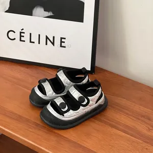 Close-up of silver quilted baby boy sandals with anti-kick toe and soft sole