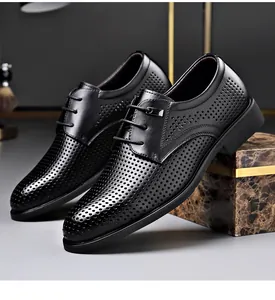 Side view of elegant black perforated men's formal dress shoes with lace-up detail