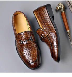 Detailed view of men's brown woven loafers featuring a stylish horsebit buckle hardware.