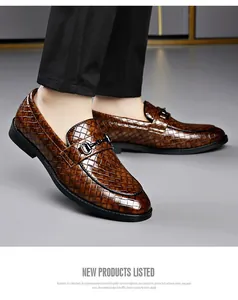 Close-up of men's brown loafers with woven texture and double metal buckle detail.