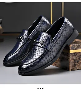 Detailed view of blue woven leather men's loafers featuring a classic metal horsebit buckle