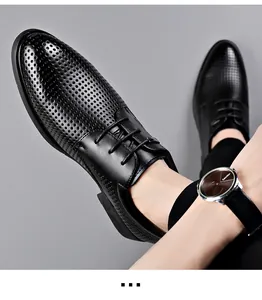 Close-up of men's black perforated breathable leather dress shoes with laces.