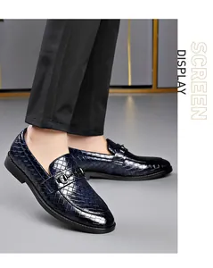 Close-up of blue woven loafers for men featuring metal buckle and elegant leather texture.
