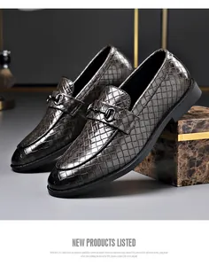 Elegant men's woven leather loafers with decorative metal bit in a business style.