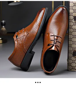Detailed view of men's brown breathable hollowed-out leather dress shoes with laces